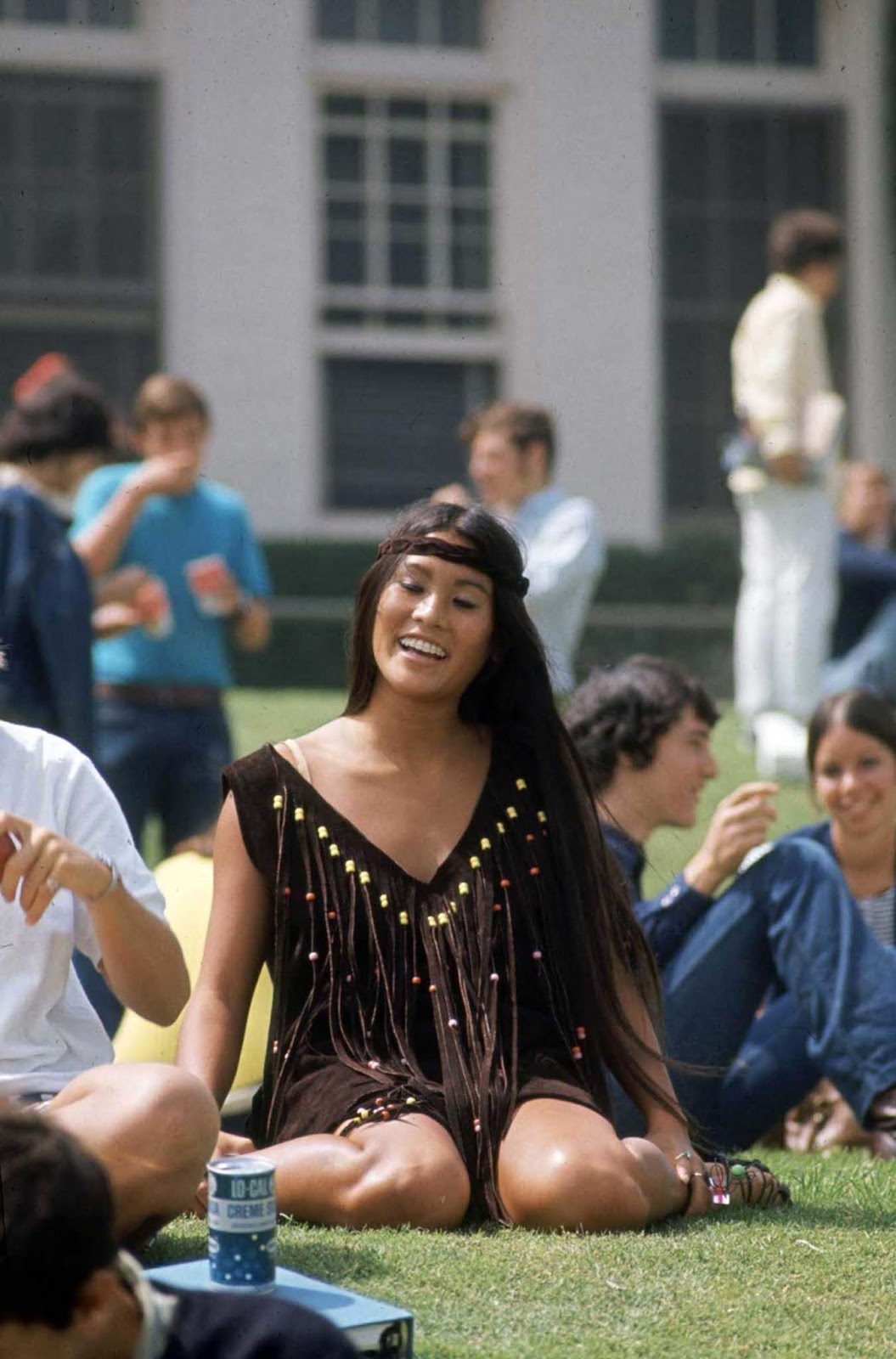 Beverly Hills High School student Rosemary Shoong, in a fringed dress she made herself. Rosemary memorized the pattern of a store dress and made this one within 24 hours. Her dress cost $14.95, the store one—$95.