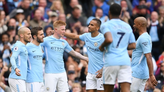 Manchester City players celebrating a goal