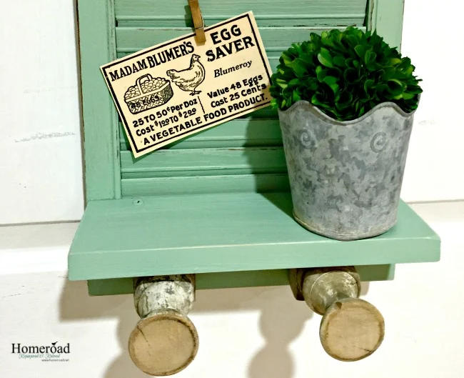 green shutter with shelf and clips with tags