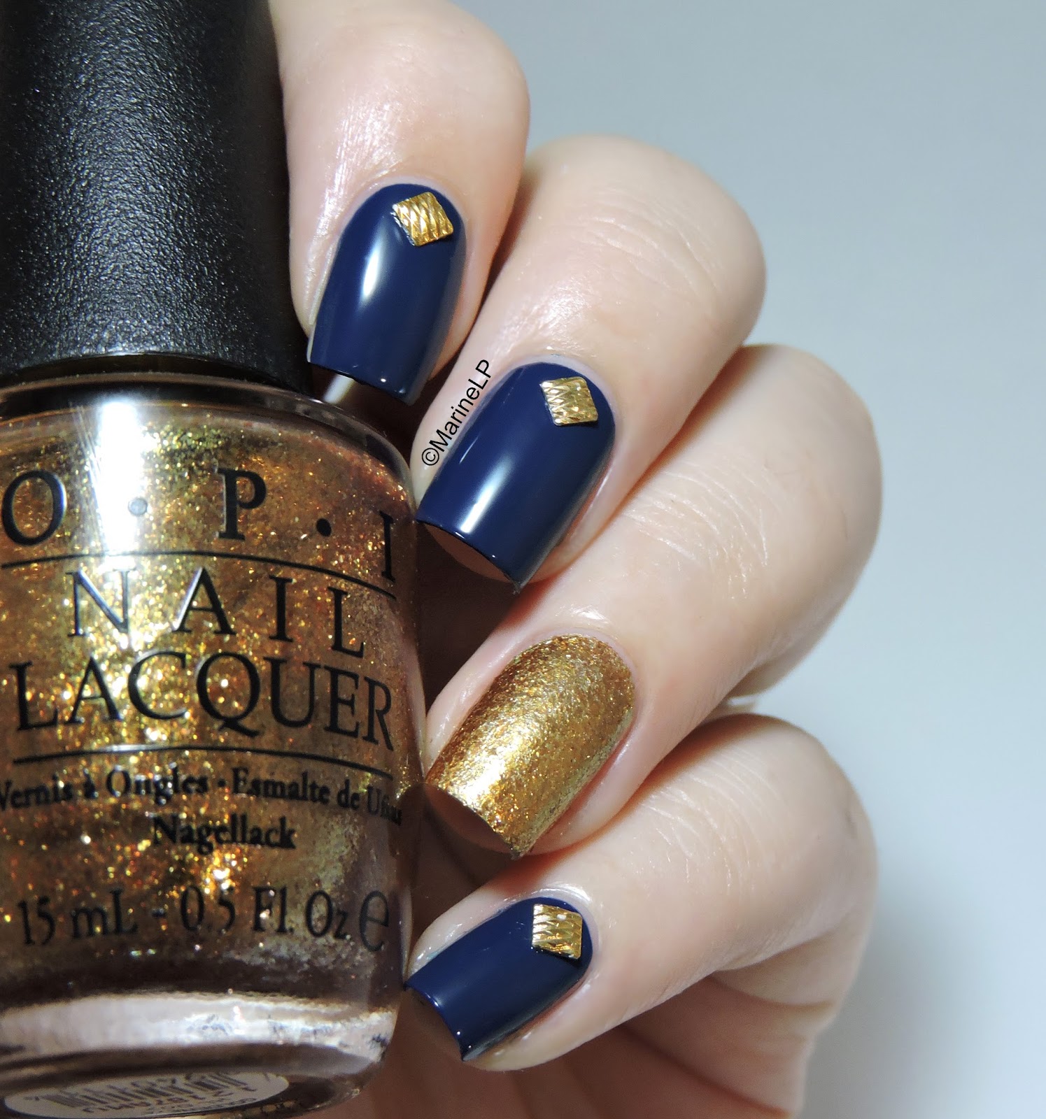 Blue and gold studded mani.
