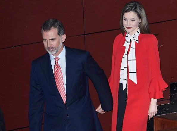 Queen Letizia wore a Zara Frilled Sleeve Coat and Roberto Verino Blouse, Carolina Herrera black-patent and suede pumps and carried Carolina Herrera Animal Print Clutch Bag