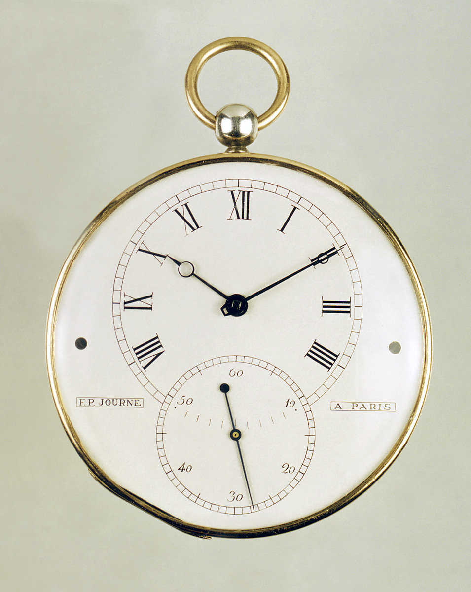 The dial is silvered with a grained texture, while the numerals and ...