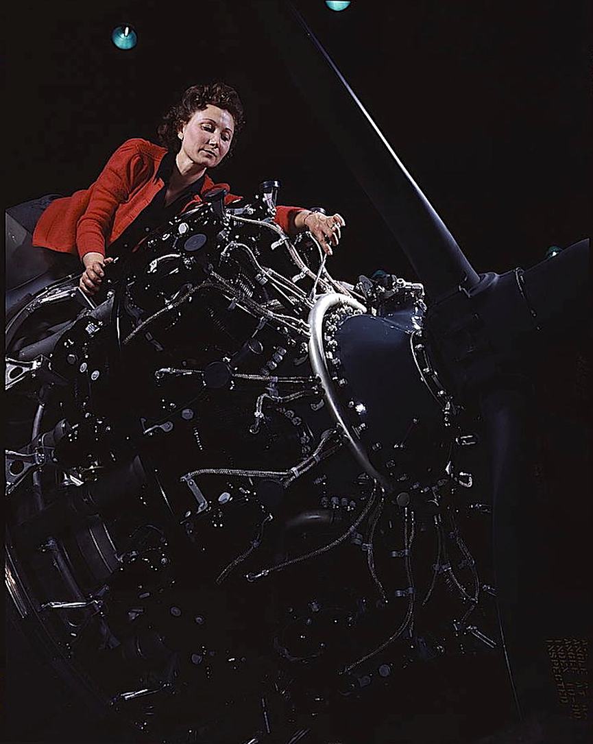 Alfred T Palmer 1942 an Alfred T Palmer photograph of a 1942 war worker, a woman adjusting a giant engine