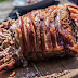 Grilled meat on brown chopping board