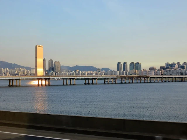 Seoul skyscraper bathed in golden hour light