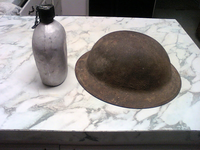 Old war helmet and canteen