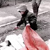 WATCH: Iranian man beats homeless boy who was looking for food in the garbage