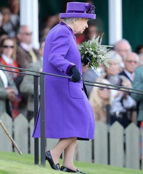 Queen Elizabeth, The Prince of Wales and Duchess of Cornwall, Autumn Phillips and Peter Phillips. Camilla wore a red wool coat by Burberry