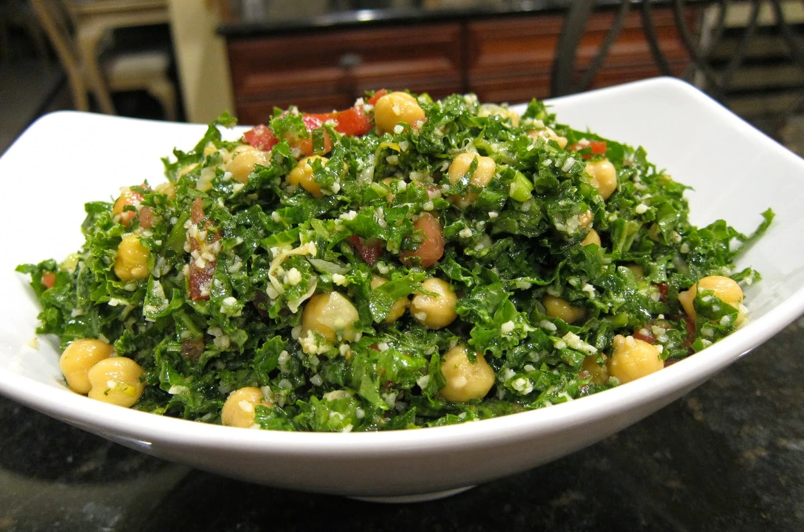 Chickpea and kale salad on a white plate