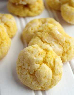 Super soft and luscious lemon cookies loaded with all of the cream cheese and butter goodness of gooey butter cake. They practically melt in your mouth! close up lemon gooey butter cookies