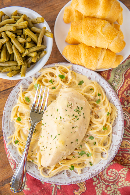 Slow Cooker Ranch Chicken - a weeknight family favorite!! Only 5 ingredients! Chicken, cream cheese, cream of chicken soup, chicken broth and ranch dressing mix. Serve over pasta, grits, rice or potatoes. Everyone cleaned their plate and asked for seconds! That never happens!!! This recipe is a keeper! #slowocoker #chicken #weeknightdinner Slow Cooker Ranch Chicken - a weeknight family favorite!! Only 5 ingredients! Chicken, cream cheese, cream of chicken soup, chicken broth and ranch dressing mix. Serve over pasta, grits, rice or potatoes. Everyone cleaned their plate and asked for seconds! That never happens!!! This recipe is a keeper! #slowocoker #chicken #weeknightdinner