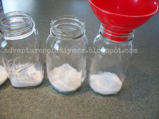 adding sugar to jars