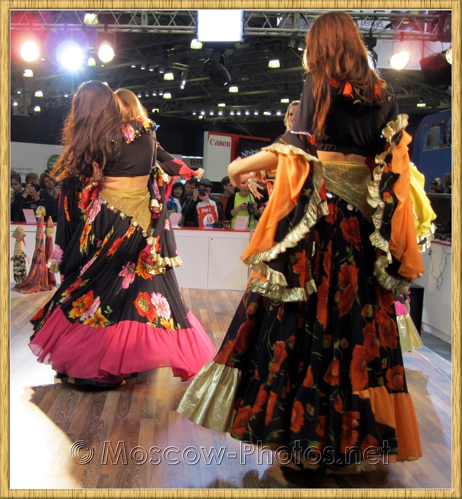 Dancing girls in colorful dresses