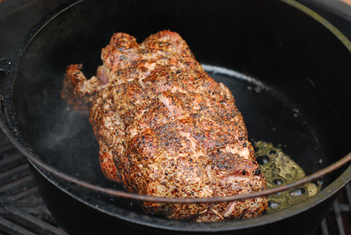 pork shoulder in dutch oven on kamado grill