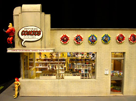Modern dolls' house miniature comic book shop in an art deco building