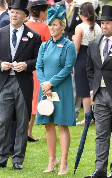 The Countess of Wessex wore a  wide-leg jumpsuit by Emilia Wickstead. Princess Eugenie wore a belted silk satin midi dress by Cefinn