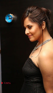 Anasuya Bharadwaj Stills in Strap Less Black Long Dress at Winner Pre Release Function