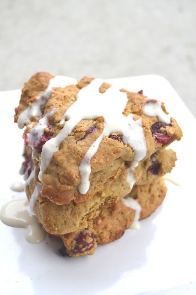 These Cranberry Scones with Coconut Vanilla Drizzle are made healthier with whole-wheat flour, yogurt, fresh cranberries and a healthier yogurt based drizzle! www.nutritionistreviews.com
