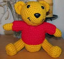 http://www.ravelry.com/patterns/library/crocheted-pooh-bear-lookalike-doll