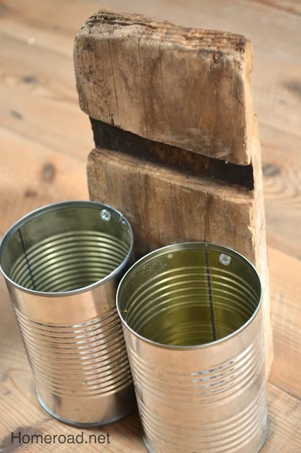 wooden barrel piece with 2 aluminum cans
