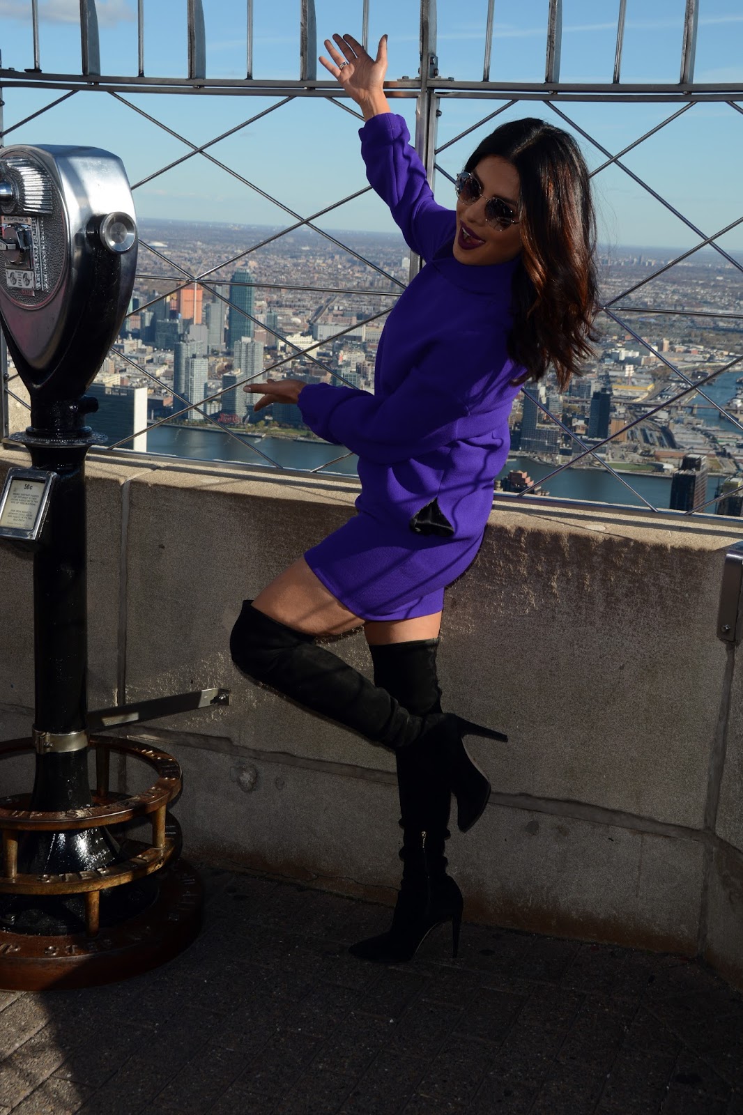 Priyanka Chopra Looks Sexy In a Purple Short Dress and Black Thigh High Boots During â€œQuanticoâ€ Promotion at The Empire State Building in New York City