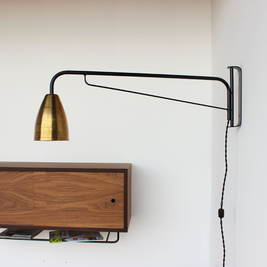 Handmade brass swing arm wall sconce by onefortythree