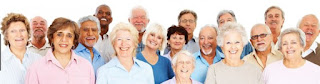 A photograph of a group of older people of various ethnicities, smiling