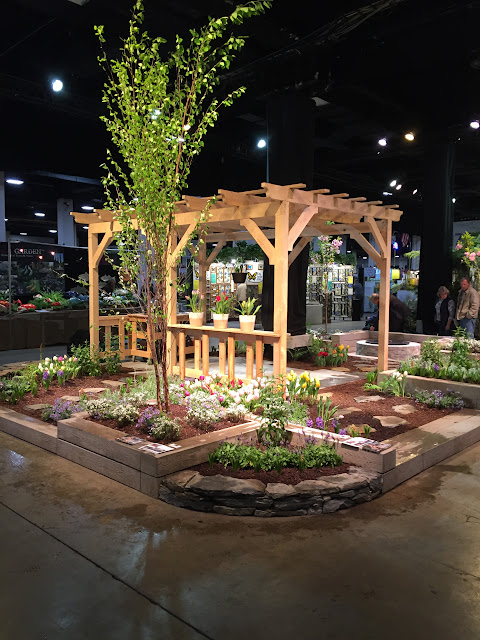 Pergola & Pretty Beds I like how they created different beds on different levels in this Pergola-centric garden