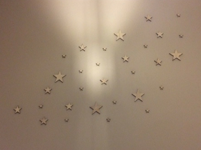 wooden stars on a grey wall