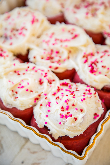 Red Velvet Cinnamon Rolls - TO-DIE-FOR delicious!!! SO easy! Start with a box of cake mix and add flour, water, and yeast. Bake and top with an amazing homemade cream cheese frosting! Makes 24 rolls. One pan for you and one for your Valentine! #redvelvet #valentinesday #cinnamonrolls Red Velvet Cinnamon Rolls - TO-DIE-FOR delicious!!! SO easy! Start with a box of cake mix and add flour, water, and yeast. Bake and top with an amazing homemade cream cheese frosting! Makes 24 rolls. One pan for you and one for your Valentine! #redvelvet #valentinesday #cinnamonrolls