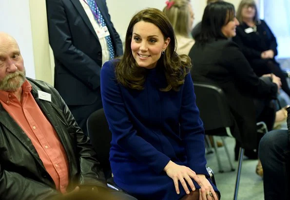 Kate Middleton wore Goat Ellory Bow Detail Coat. Duchess Catherine of Cambridge carried Beulah London Aspinal Blue Heart Clutch