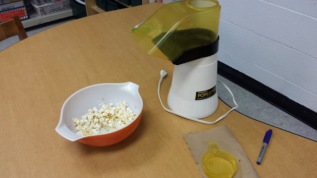photo of air popped popcorn and popping machine.