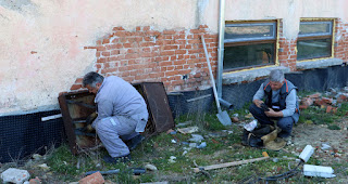 The telephone engineers removing the junction box The telephone engineers removing the junction box