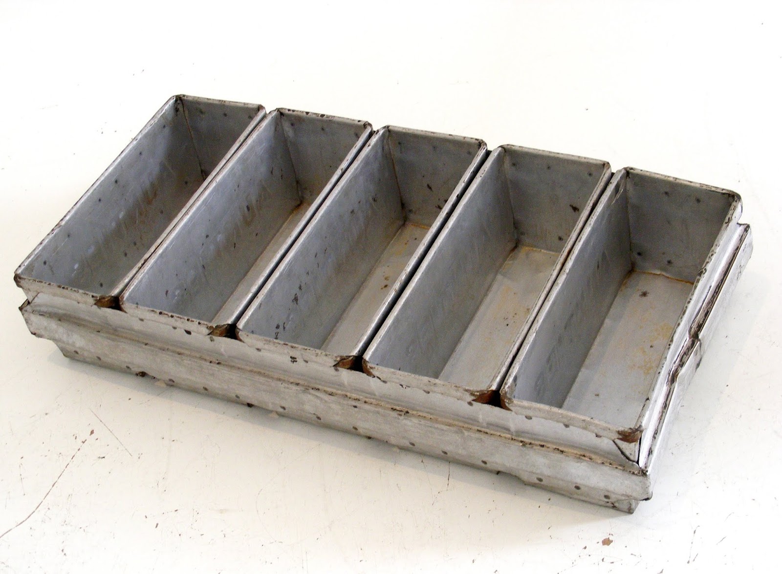 VAMP FURNITURE A vintage industrial size bread baking tin.