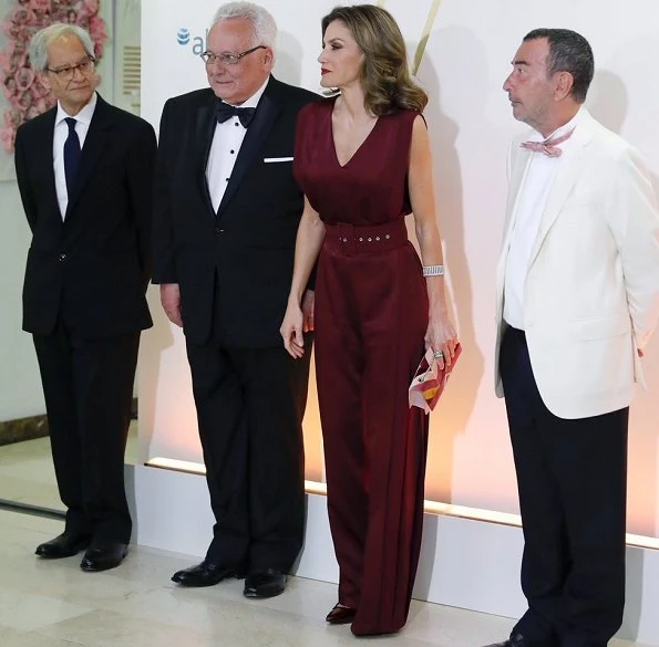 Queen Letizia wore Carılina Herrera Jumpsuit, Carolina Herrera Print-Clutch Bag, Carolina Herrera Suede pumps