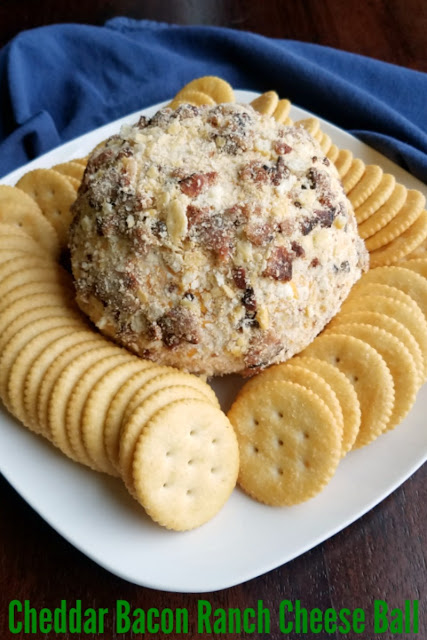 Cheddar, bacon and ranch are a perfect combination of flavors for a cheese ball. Get your crackers ready and watch this disappear right before your eyes! Cheddar, bacon and ranch are a perfect combination of flavors for a cheese ball. Get your crackers ready and watch this disappear right before your eyes!