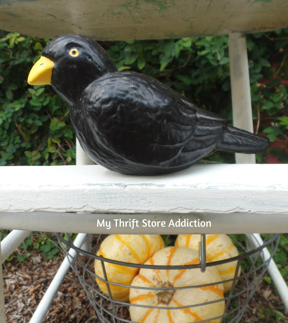 A yard sale crow adds a touch of whimsy to this farmhouse display upcycled from a vintage high chair! vintage high chair upcycle