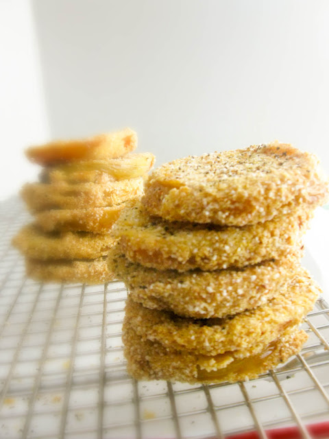 Fried Green Tomatoes, crispy on the outside tender and meaty on the inside.  Serve them as an easy appetizer or stack them for an elegant side dish.
