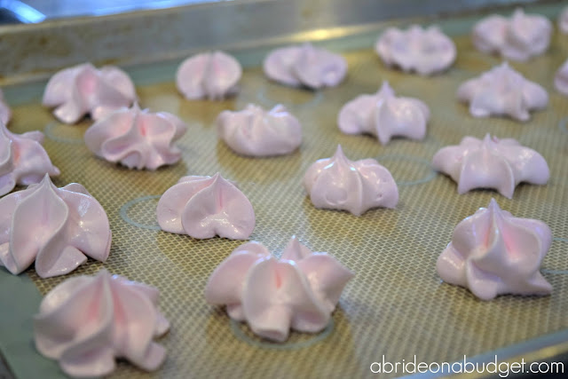 Edible wedding favors are the best. These Homemade Meringue Cookies Wedding Favors are simple, delicious, and budget-friendly favors. Get the recipe at www.abrideonabudget.com.