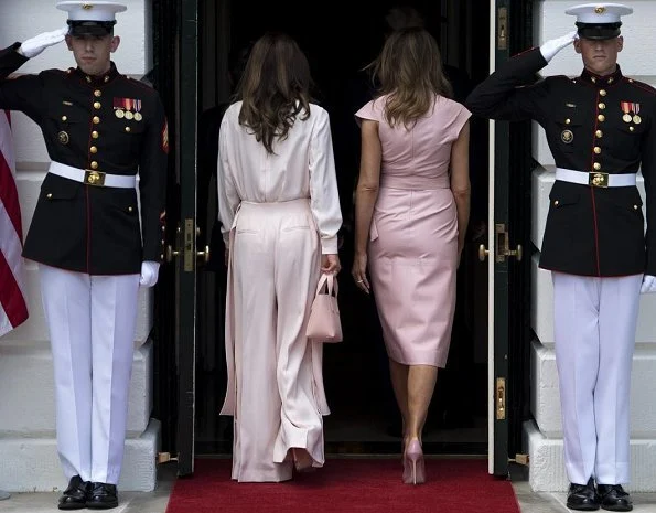 Queen Rania wore a baby pink jumpsuit by Adeam. First Lady Melania Trump wore a pink sleeveless wrap around dress by Proenza Schouler