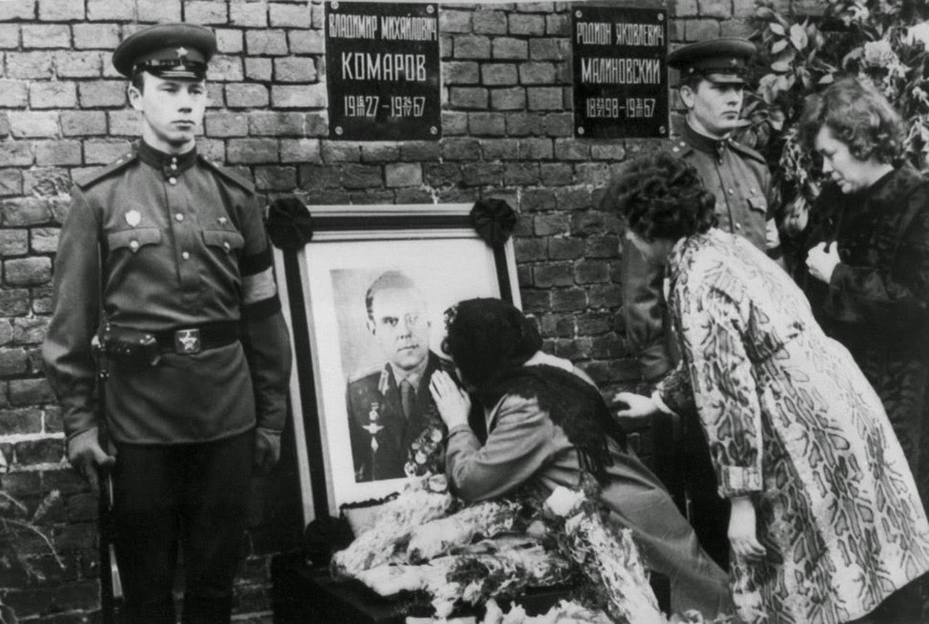 Valentina Komarov, the widow of Soviet cosmonaut Vladimir Komarov, kisses a photograph of her dead husband during his official funeral, held in Moscow's Red Square on April 26, 1967. 
