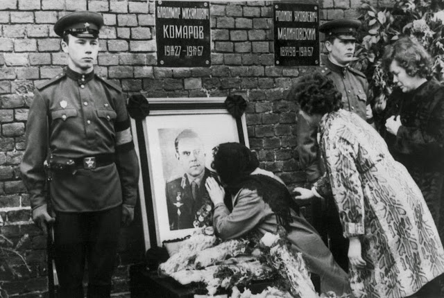 Valentina Komarov, the widow of Soviet cosmonaut Vladimir Komarov, kisses a photograph of her dead husband during his official funeral, held in Moscow's Red Square on April 26, 1967.