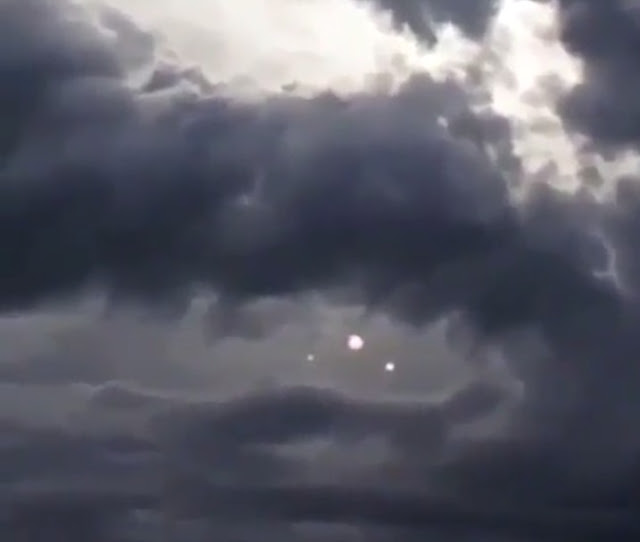 Here is what all the fuss is about which shows us three light Orbs in the middle of the clouds in a formation like the air force. Here-is-what-all-the-fuss-is-about-which-shows-us-three-light-Orbs-in-the-middle-of-the-clouds-in-a-formation-like-the-air-force.