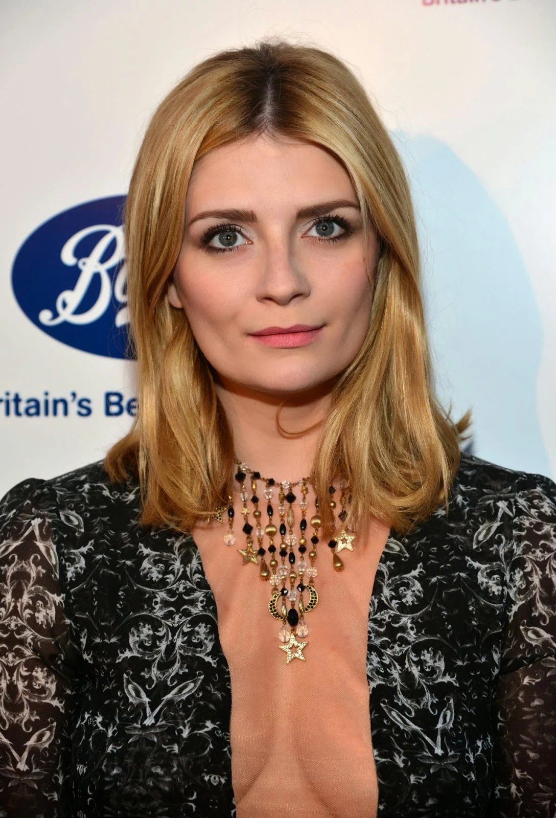Mischa Barton wears a plunging dress to the 2014 BritWeek Launch Party