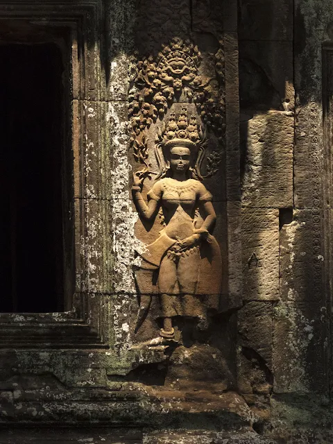 12th century woman carved into the temple wall at Angkor Wat