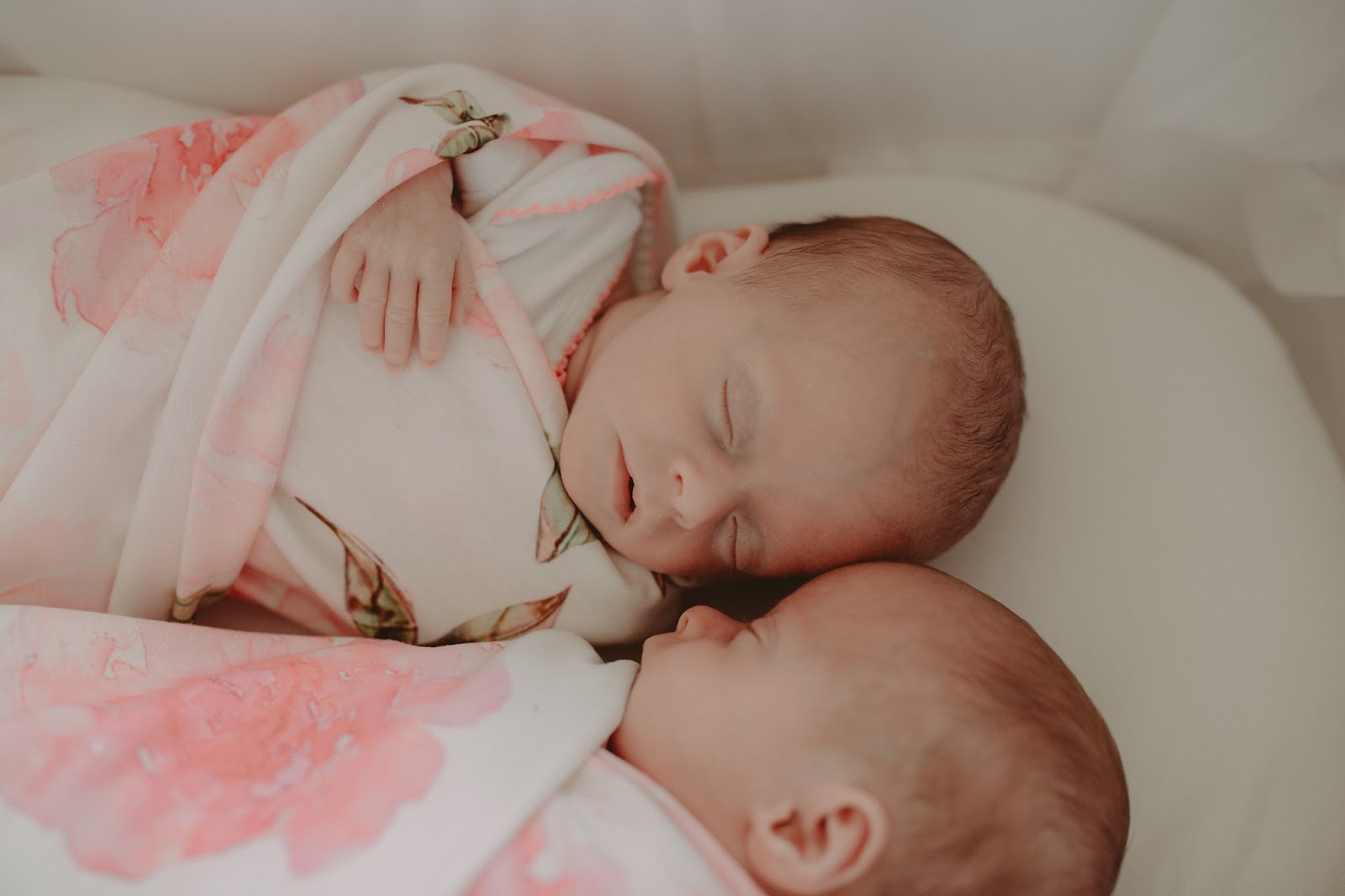 identical twin girls swaddled mothercare