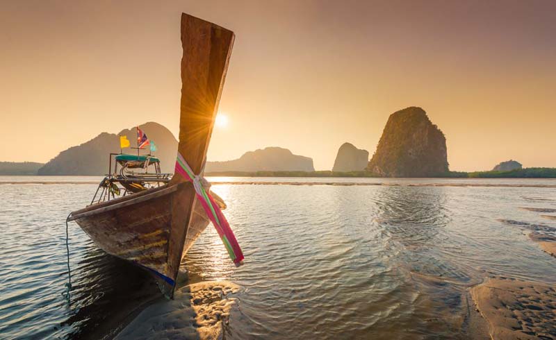 Longtail boat and islands for a vacation in Thailand