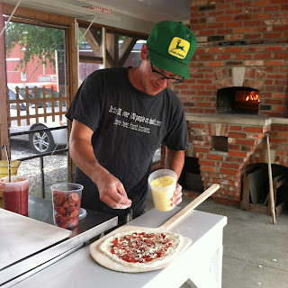 Zach Hawkins preparing a pizza at Hawkins Family Farm - FoyUpdate.blogspot.com