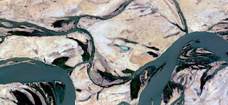 sad boy,abstract landscapes of deserts of Africa ,Abstract Naturalism,abstract photography deserts of Africa from the air,abstract surrealism,mirage in Sahara desert,fabric design land from the air, stone art, munimara photos, fantasy forms of stone and colors in the desert, aerial, artistic, land, photography, rivers, surreal, waves, yellow gray,