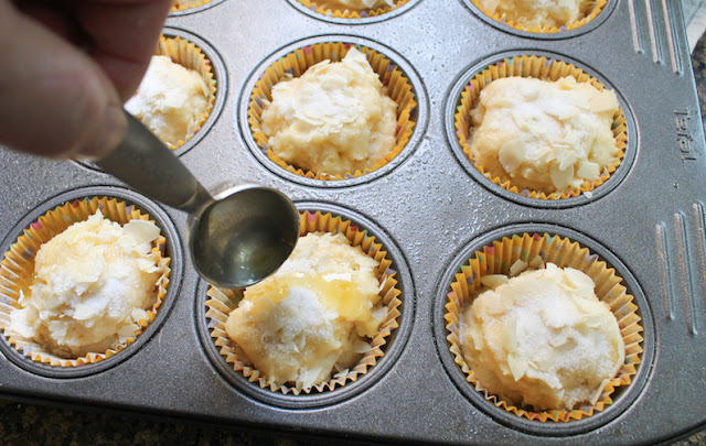 Food Lust People Love: These delightful butter cake muffins are my easy take on German butterkuchen. They are made with butter, cream and apples and topped with the traditional sugar and almonds. But you can have these on the snack table in under half an hour. Tart chopped apple balances the sweetness of these tasty muffins but what really makes them special is the sugar, almond and butter topping. The sugar turns crunchy and the butter soaks in and they are glorious together.